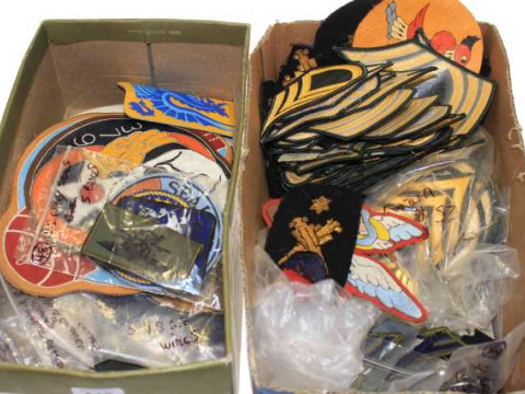 Two boxes of military badges, U.S. and other
