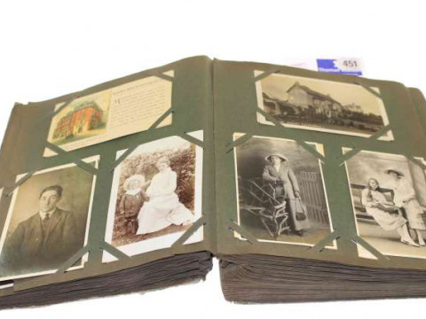 Album of late 19th Century/early 20th Century postcards and photographs