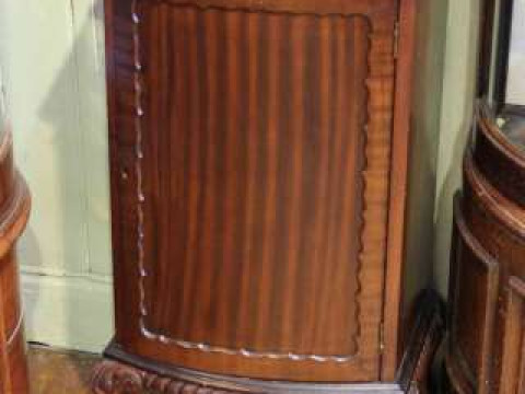Mahogany Chippendale style bow front music cabinet on ball and claw legs