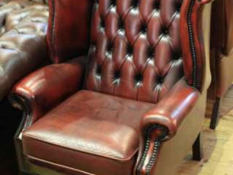 Pair ox blood buttoned leather wing back easy chairs on cabriole legs