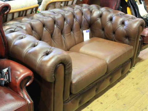 Brown leather deep buttoned two seater Chesterfield settee