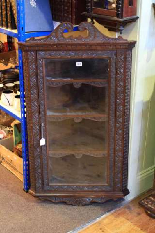 Carved oak glazed door corner wall cabinet