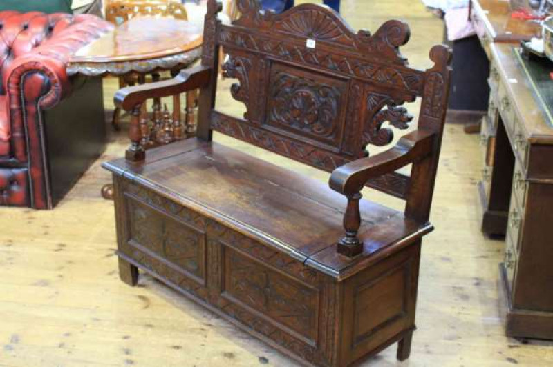 Carved oak shaped back hall settle