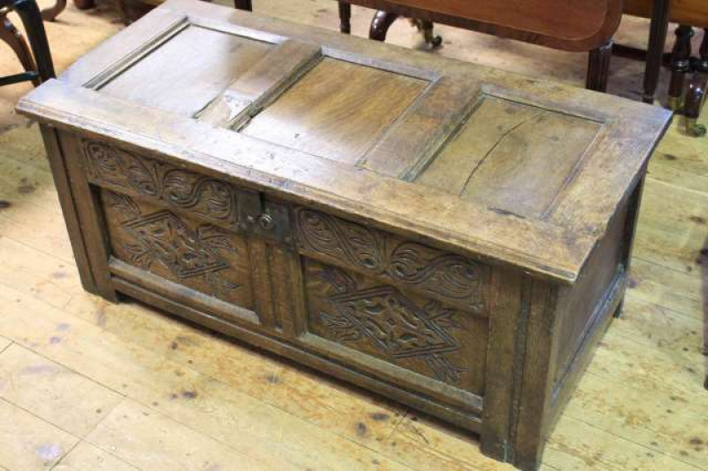 Antique carved oak coffer with internal candle box