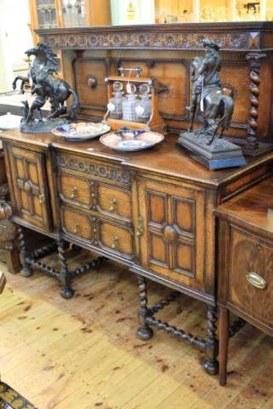 Oak Jacobean style inverted breakfront sideboard with raised back