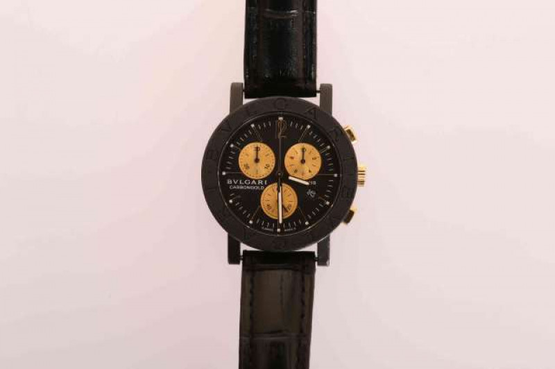 A BULGARI CARBONGOLD PARIS LIMITED EDITION WRISTWATCH, no. 255/999, the black dial with baton markers, three subsidiary dials, calendar at '4' and centre sweep seconds, on leather straps. 38mm
