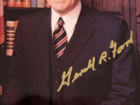 A SIGNED PHOTOGRAPH OF GERALD FORD, colour, half length, posed of a beaming...