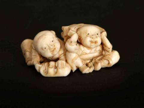A SMALL JAPANESE IVORY OKIMONO, Meiji period (1868-1912), carved as two...