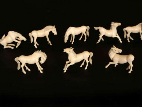 A SET OF EIGHT CHINESE IVORY HORSES OF MU WANG, early 20th Century, carved...