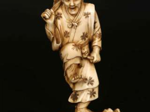 A JAPANESE IVORY OKIMONO, Meiji period (1868-1912), finely carved as a...