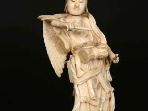 A JAPANESE IVORY OKIMONO, Meiji period (1868-1912), carved as a winged...
