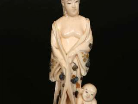 A JAPANESE IVORY AND SHIBAYAMA OKIMONO, Meiji period (1868-1912), carved...