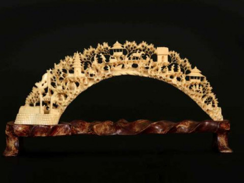 A CHINESE IVORY CARVING, CANTON, 19TH CENTURY, the tusk carved and pierced...