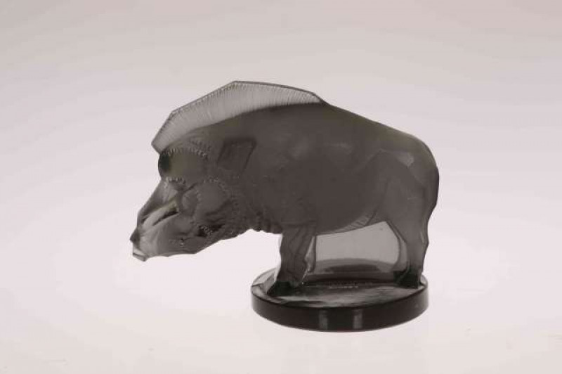 A LALIQUE 'SANGLIER' CAR MASCOT, modelled as a wild boar, smokey grey glass, etched R. LALIQUE FRANCE. 6.5cm high