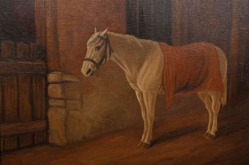 BRITISH SCHOOL (C.1900), A GREY HORSE STANDING BY A STABLE, oil on canvas, 34cm by 44cm