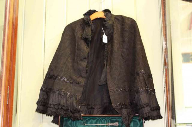 Two Oriental fans and Victorian mourning cape