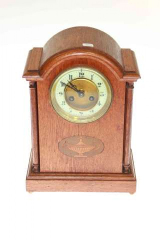 Oak arched top mantel clock with enamelled dial