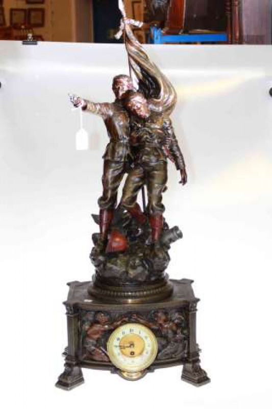 Large spelter figure clock ''The Last Stand'' with enamelled dial 94cm high