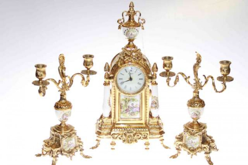 Ornate gilt metal three piece clock garniture