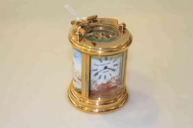 Small brass cased carriage clock, signed Elliott & Son, London