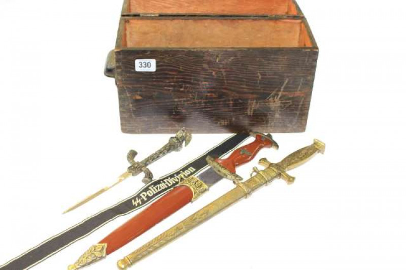 Three daggers, band and a box bearing Nazi insignia