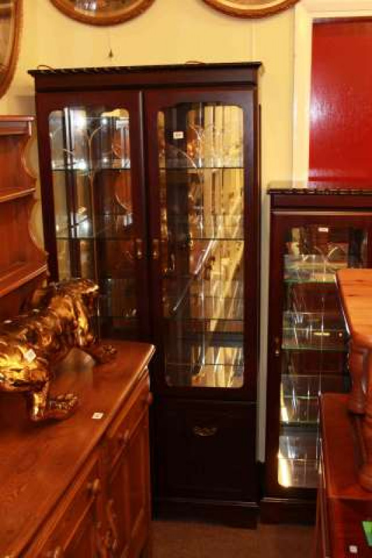 Two mahogany illuminated display cabinets and rectangular pine coffee table (3)