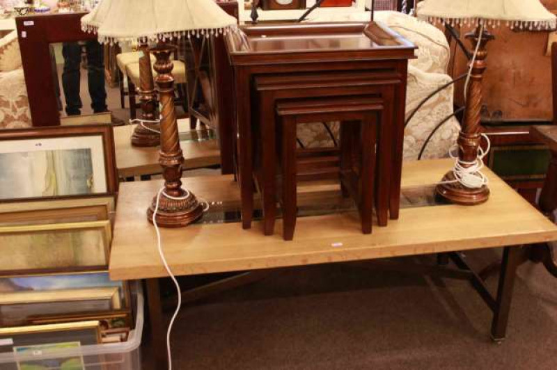 Mahogany nest of three tables, rectangular light oak and glass inset low centre table, iron headboard and framed mirror (4)
