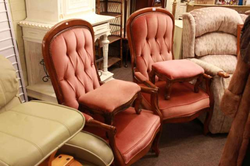 Pair of Grant International open armchairs and footstools in rose buttoned fabric