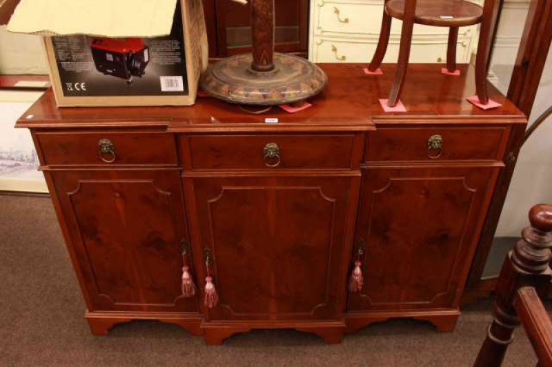 Yew breakfront three door sideboard