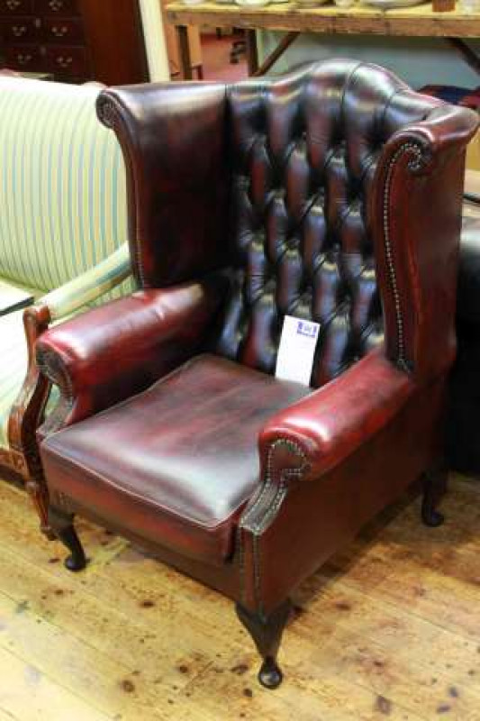 Ox Blood deep buttoned leather wing back easy chair