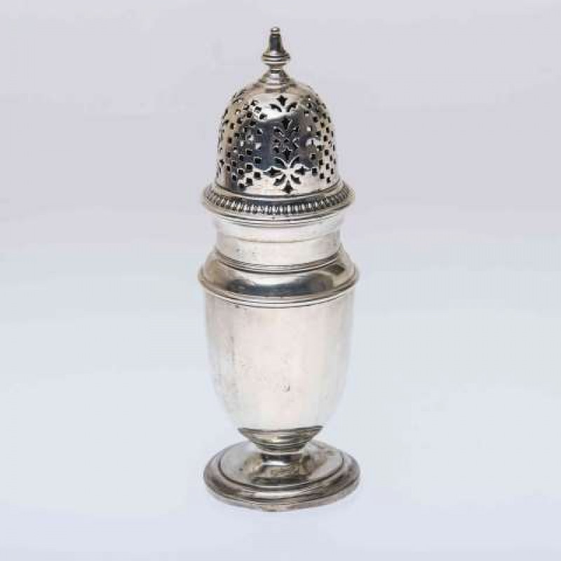 A SILVER SUGAR CASTER, Birmingham 1936, with faceted body and pierced domed cover. 3.9oz, 18cm