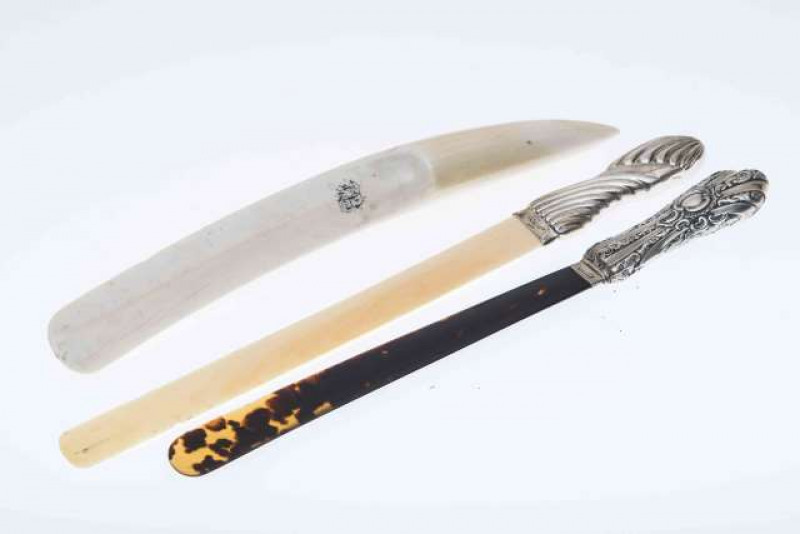 A VICTORIAN SILVER AND TORTOISESHELL PAGE TURNER, Birmingham 1892; together with A VICTORIAN SILVER AND IVORY PAGE TURNER, London 1898; and A 19TH CENTURY IVORY PAGE TURNER, monogrammed. (3) First 31.5cm