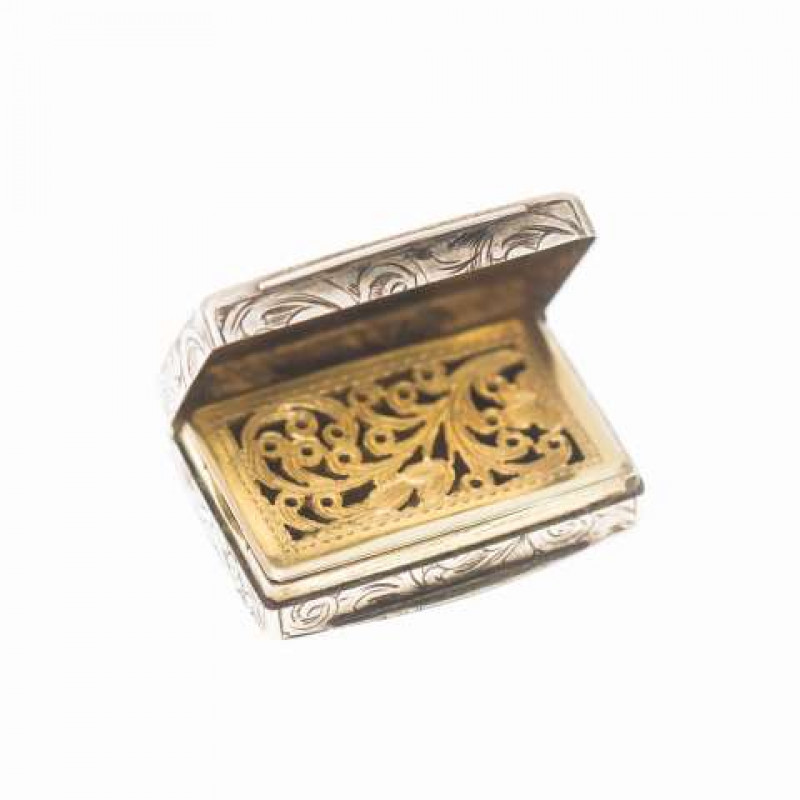 A VICTORIAN SILVER VINAIGRETTE, George Unite, Birmingham town mark but no date letter, the case engraved with scrollwork. 30mm by 21mm