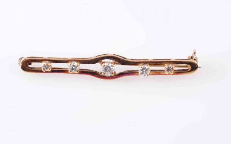 A COLLECTION OF BROOCHES, to include A LATE VICTORIAN FIVE STONE DIAMOND AND GOLD BAR BROOCH,  the five graduating old brilliant-cut diamonds claw set above a pierced mount, hallmarked for 9 carat gold; AN AMETHYST, EMERALD, SEED PEARL AND GOLD BROOCH, CI