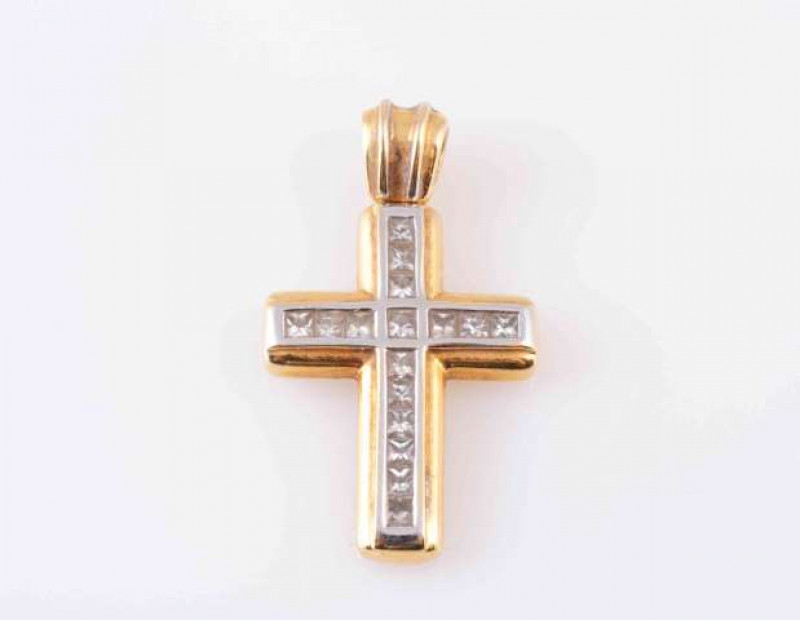 A DIAMOND PENDANT, modelled as a cross, set with sixteen princess-cut diamonds channel set in white and yellow gold coloured mount, on moulded bale. 2.8cm x 2.5cm. Total weight approximately 4.6 gms.