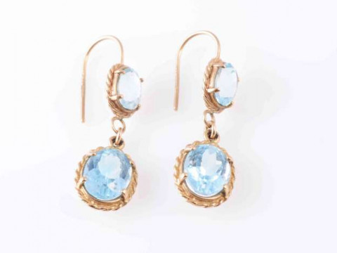 A PAIR OF AQUAMARINE EARRINGS, the oval cut aquamarine four claw set in...