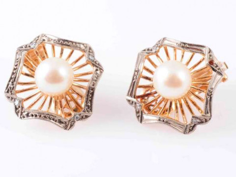 A PAIR OF CULTURED PEARL EARRINGS, the single cultured pearl set to the...