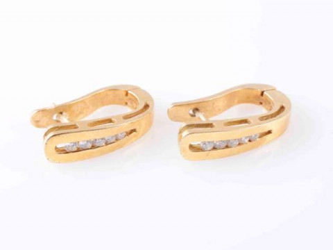 A PAIR OF DIAMOND SET EARRINGS, the five graduating brilliant cut diamonds...