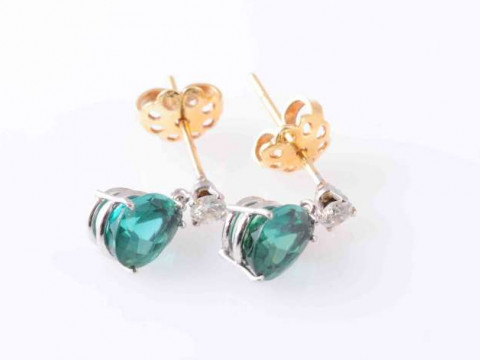 A PAIR OF TOURMALINE AND DIAMOND EARRINGS, the pear cut dark green tourmaline...