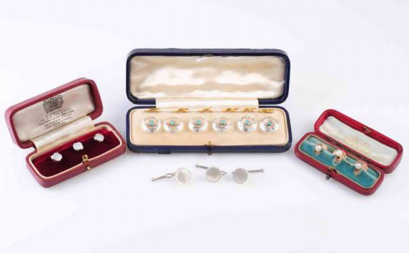 A SET OF THREE MOTHER OF PEARL SHIRT STUDS, the square cut mother of pearl plaques simply collet set on stud fittings. Each stamped DA and 375. In a fitted Asprey & Co box. Total weight 2.8gms, A SET OF THREE CULTURED PEARL SHIRT STUDS, each set with a si
