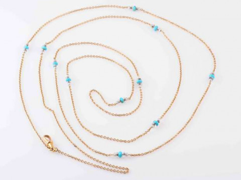 A TURQUOISE AND SEED PEARL SET WATCH CHAIN, CIRCA 1900, the double row...