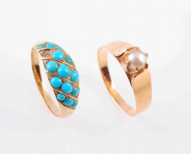 A TURQUOISE SET RING, CIRCA 1900, the fourteen graduating round cut turquoise stones set in a tapering mount. One turquoise lacking. Ring size K. Weight 2.4gms, AND A CULTURED PEARL RING, the single cultured pearl six claw set between heavy tapering shoul
