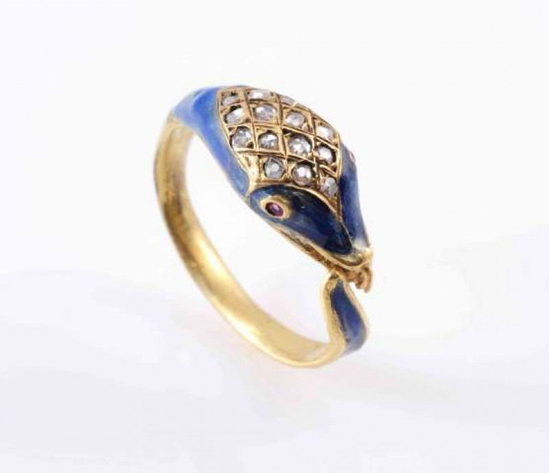 A VICTORIAN GOLD, ENAMEL AND DIAMOND SNAKE RING, CIRCA 1860, the head set with blue enamel and pave set rose-cut diamonds with red gem set eyes. Ring size I 1/2. Total weight 4.3 gms