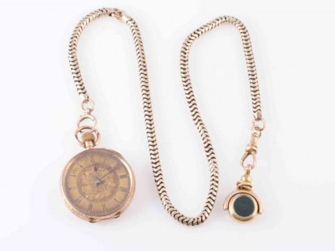 A CONTINENTAL 14 CARAT GOLD FOB WATCH, the circular dial with Roman numerals...