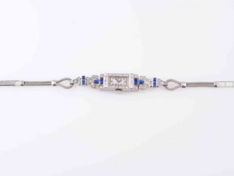 AN ART DECO SAPPHIRE AND DIAMOND LADY'S COCKTAIL WATCH, the rectangular...