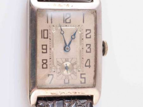 A SILVER TANK CASED WRISTWATCH, the rectangular dial with subsidiary seconds...