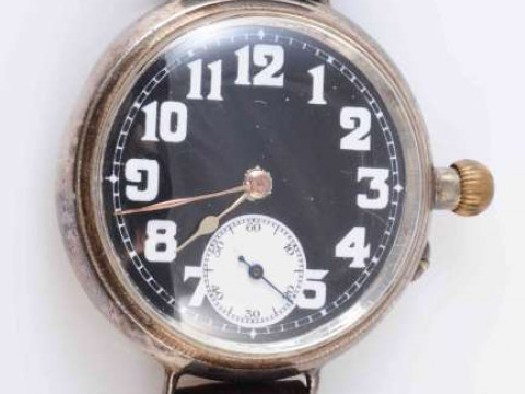A WWI OFFICER'S TRENCH WATCH, with rare black dial and subsidiary seconds,...
