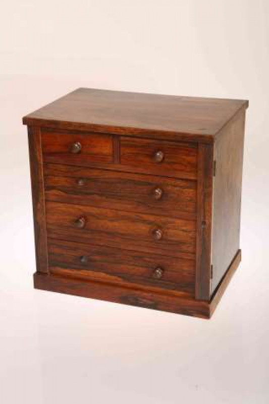A 19TH CENTURY ROSEWOOD MINIATURE CHEST OF DRAWERS, with side locking pilaster. 34.5cm by 34.5cm by 24cm