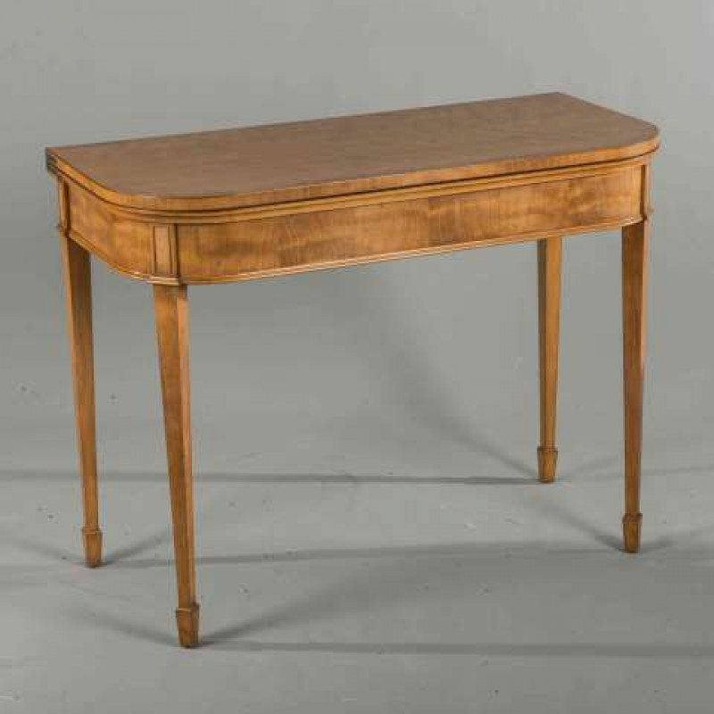 A LATE 19TH CENTURY SATINWOOD FOLDOVER CARD TABLE, the crossbanded top with rounded corners, raised on square section tapering legs. 75cm by 96.5cm by 45cm (closed)