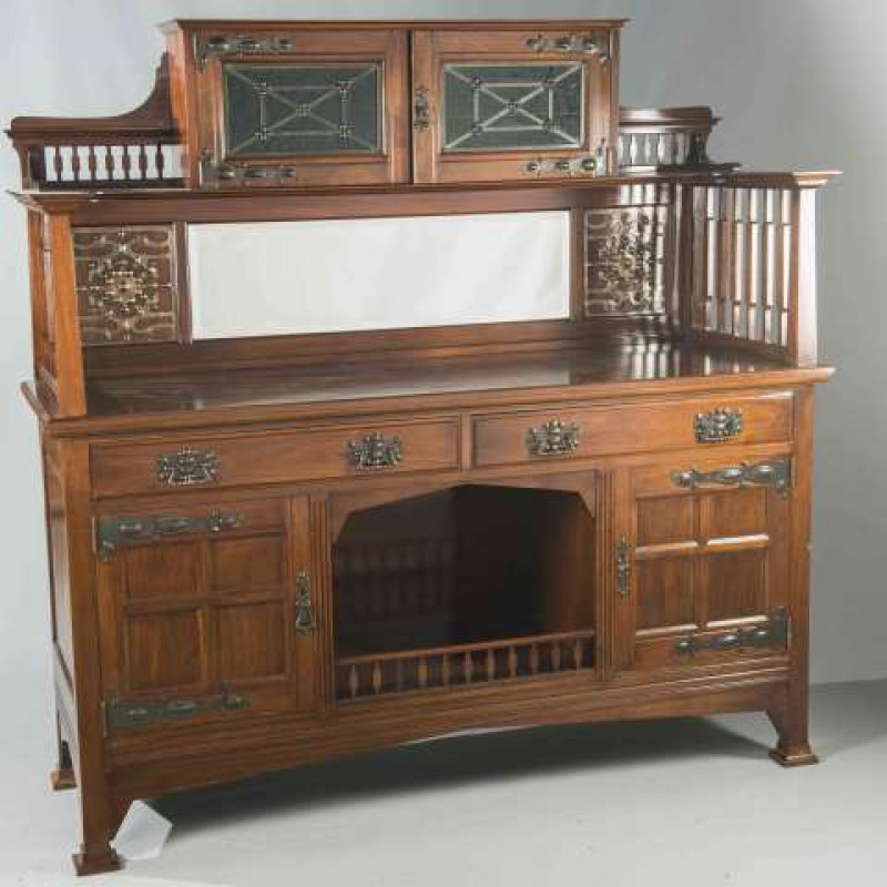 AN ART NOUVEAU MAHOGANY MIRROR BACK SIDEBOARD, CIRCA 1900, the superstructure with a cupboard with leaded glass, the base with 'dog kennel', fitted with copper hinges and handles. 181cm by 183cm by 60.5cm